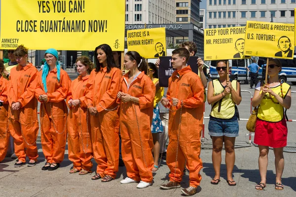 Amnesty International activists protest at Potsdamer Platz near the Ritz-Carlton, because of his state visit to Germany by US President Barack Obama