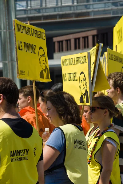Amnesty International activists protest at Potsdamer Platz