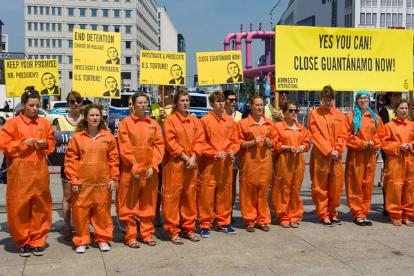 Amnesty International activists protest at Potsdamer Platz