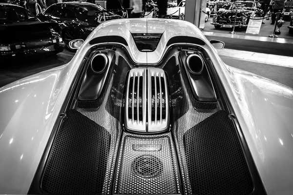 The engine compartment of a mid-engined plug-in hybrid sports car Porsche 918 Spyder, 2015