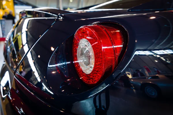 The rear brake lights of sports car Ferrari 599 GTB Fiorano F1, 2008.