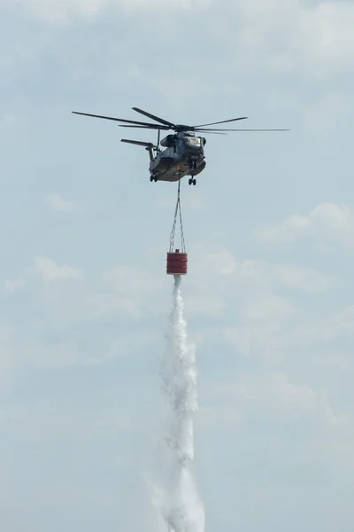 Heavy-lift cargo helicopter Sikorsky CH-53 Sea Stallion of the German Army with equipment for fighting fires.