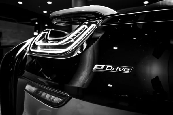 BERLIN - NOVEMBER 28, 2014: Showroom. The rear lights of the car BMW i8, first introduced as the BMW Concept Vision Efficient Dynamics, is a plug-in hybrid sports car developed by BMW. Black and white