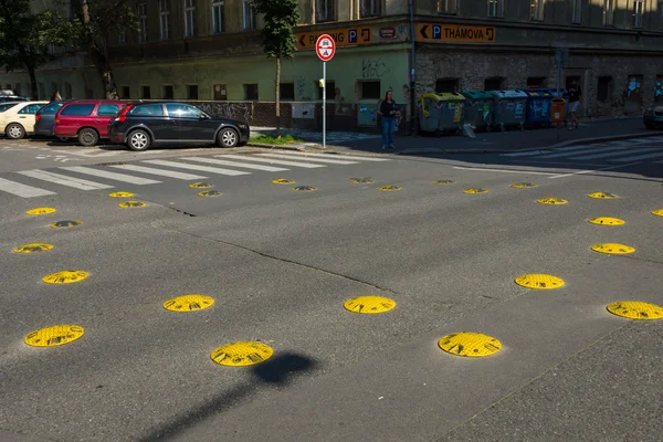 Speed bump at a crossroads. Prague is the capital and largest city of the Czech Republic.