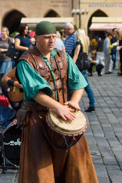 Performance of street musicians in medieval clothes
