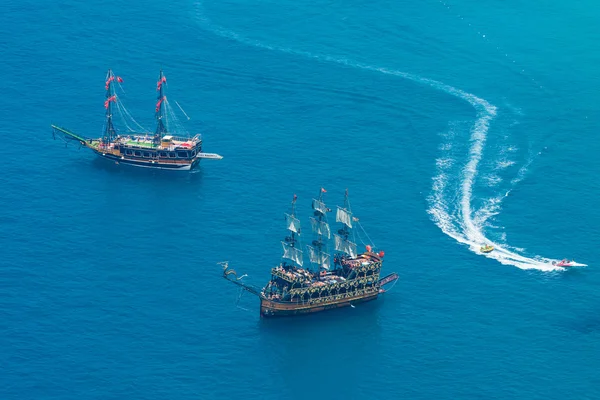Traditional entertainment resort of Alanya. Sailing aka pirate ships around the fortress of Alanya