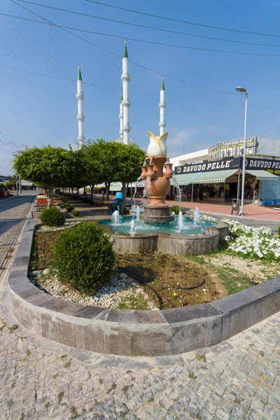 Center of the popular tourist town of Konakli, a mosque in the background. Anatolian coast - a popular holiday destination for European tourists.