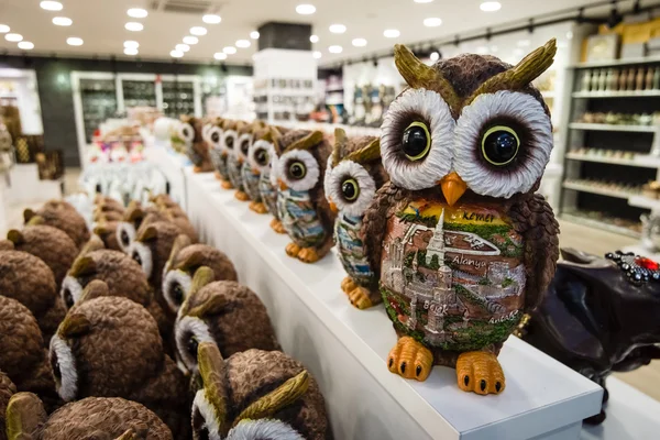 Sales of souvenirs (owl) in one of the shops, large and popular among tourists shopping center on the Anatolian coast, near the town of Alanya