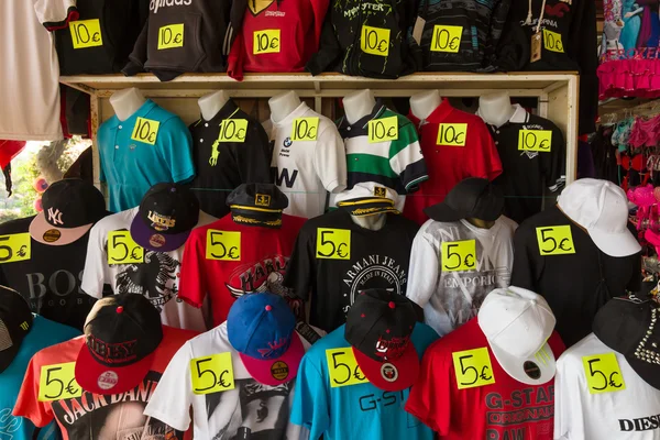 Sales to the local market of t-shirts, baseball caps and hats