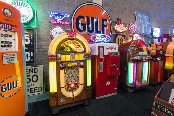 Various retro jukeboxes and retro refrigerator Coca-Cola