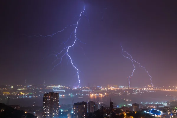 Lightning bolt over city.