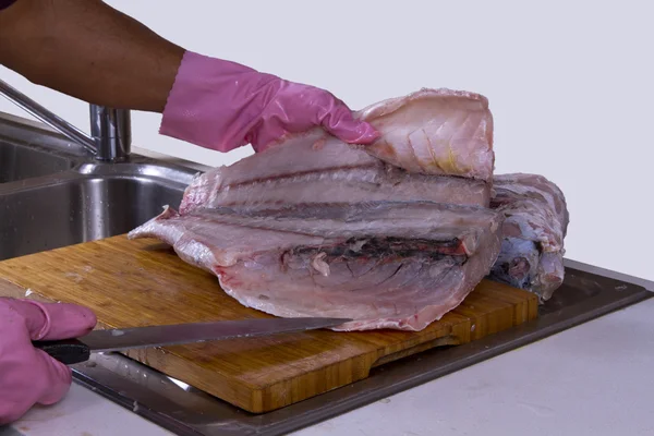 Expert Chef Cutting and cleaning big fish in a clean and hygiene