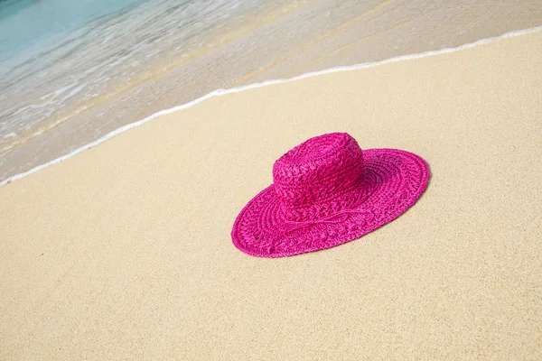 Pink Hat on a Sandy Beach