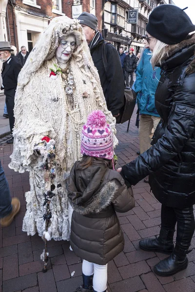 ROCHESTER, UK-DECEMBER 6: People dressed in fine Victorian costumes parade in the streets in the annual Rochester Dickensian Christmas Festival, December 6, 2014, Rochester UK.