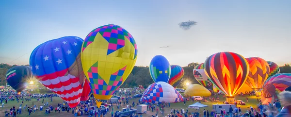 Bright Hot Air Balloons Glowing at Night