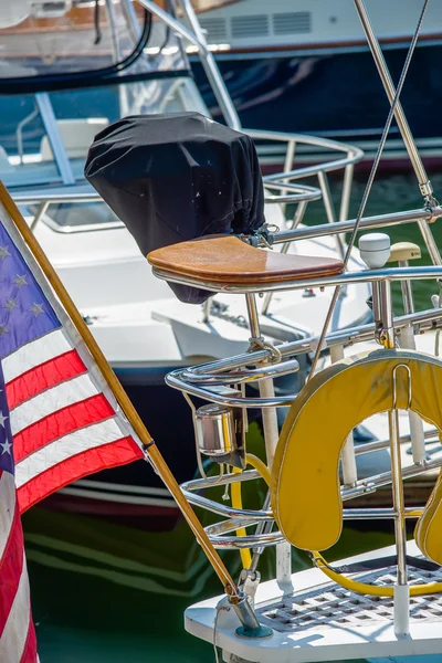 Boat captains seat with american flag