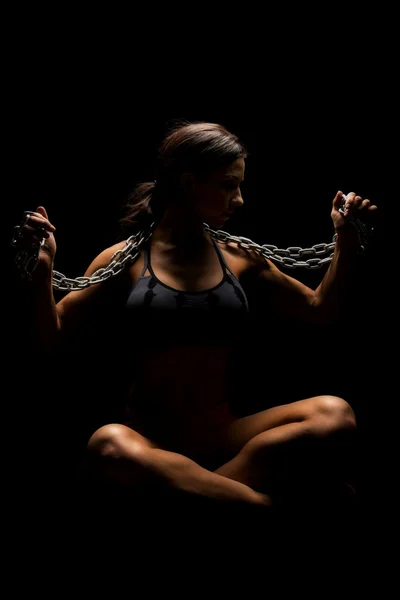 Fitness young woman with chain