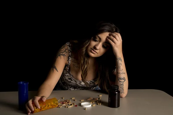 Unhappy woman with drugs