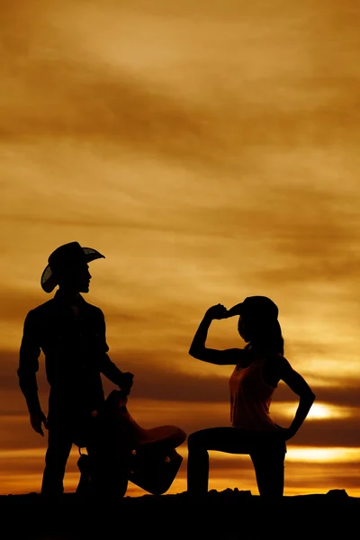 Silhouette of cowgirl and cowboy