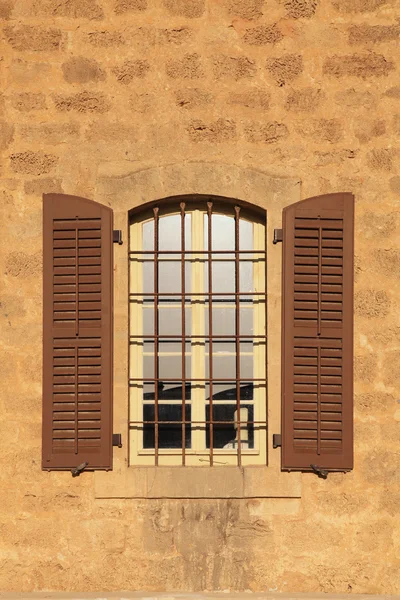 Old window with shutters in stone wall, Jaffa, Tel Aviv, Israel