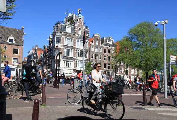 Local people on bicycle in historical center in Amsterdam, the N