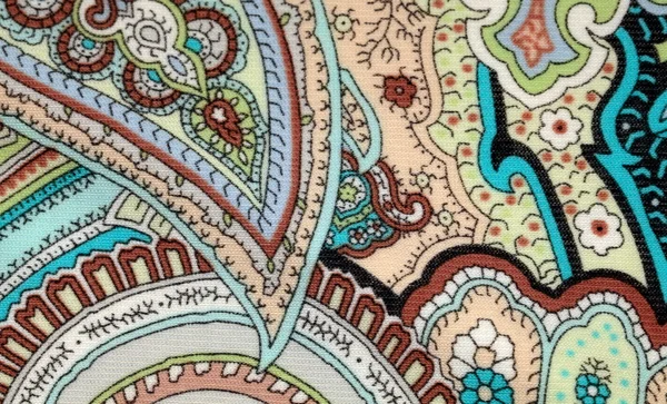 Colorful vintage fabric with blue and brown paisley print