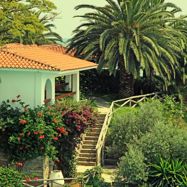 Beautiful white house in the mediterranean garden(Greece).