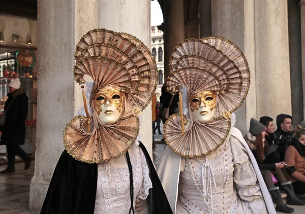 Masked persons in costume, Venice, Italy.