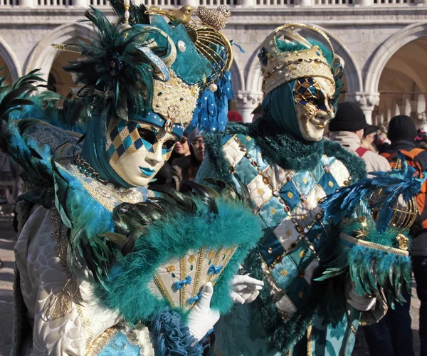 Masked persons in costume on San Marco Square during the Carniva