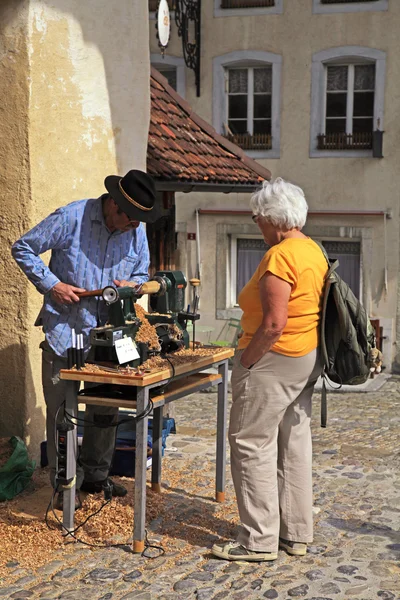 Artisan make craft in the swiss village Gruyeres, Switzerland.