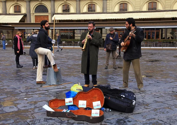 Street musicians band perform in the street at Florence