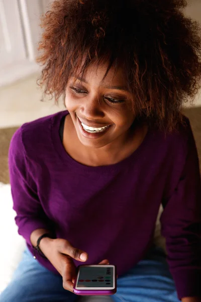 Smiling woman with cell phone