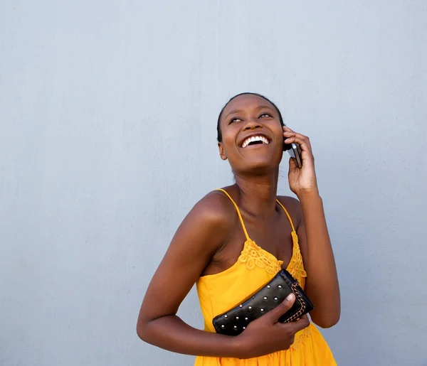 Young african lady talking on cellphone
