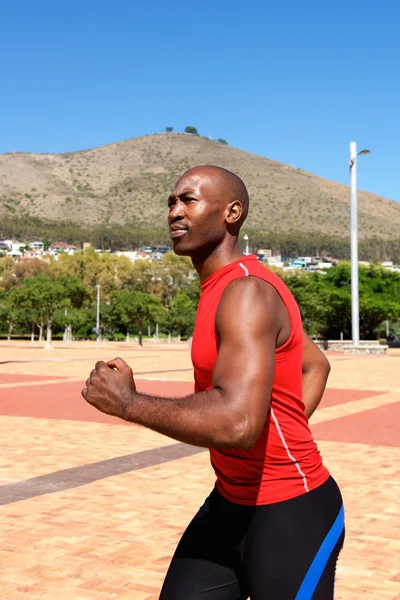 African sportsman jogging outdoors