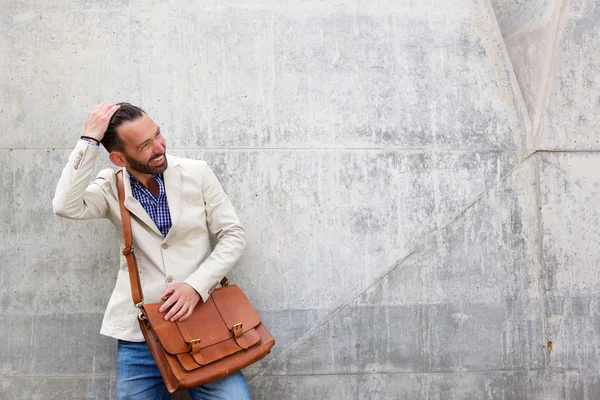 Charming man with leather bag
