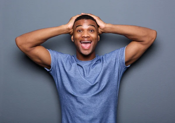 Young man with surprised expression on face