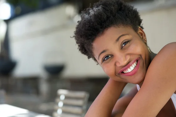 Attractive young black woman smiling outdoors