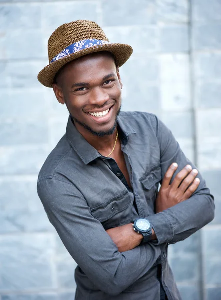 Handsome african american man smiling with arms crossed