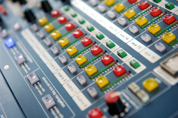 Buttons and knobs on audio mixer