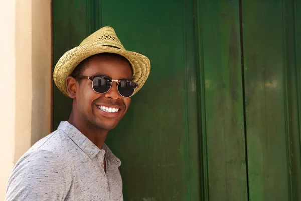 Happy guy with hat and sunglasses