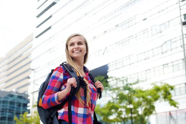 Smiling female college student with bag