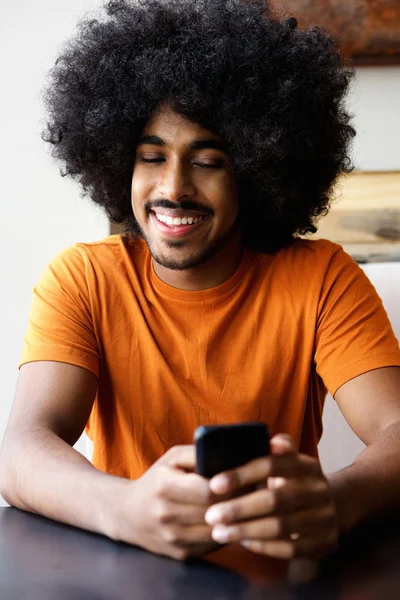 Happy guy looking at cellphone