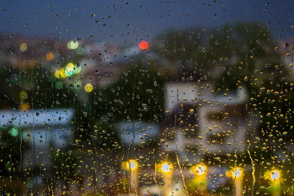 Abstract background raindrops on  blurred lights background