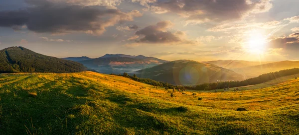 Agricultural field in mountains at sunset