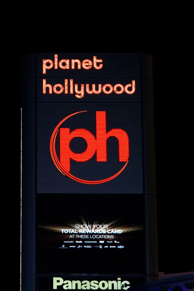 Planet Hollywood Sign and Logo at Night