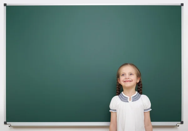 Schoolgirl near school board