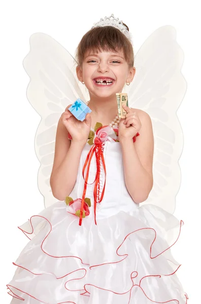 Lost tooth child dressed as tooth fairy with gifts and money