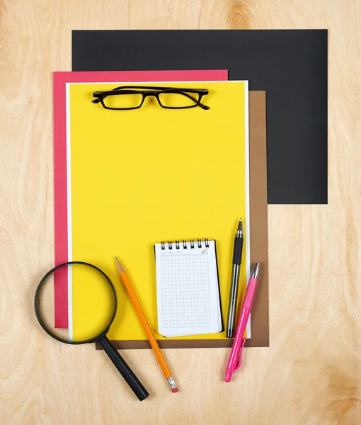 Flat lay office tools and supplies. Education background with stationery on wood. Flat design of creative office workspace, workplace. Top view of desk background.