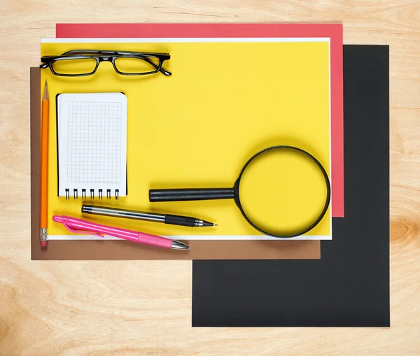 Flat lay office tools and supplies. Flat design and top view of workspace, workplace on desk. Stationery on wood background.