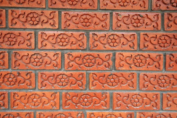 Brick wall with floral pattern